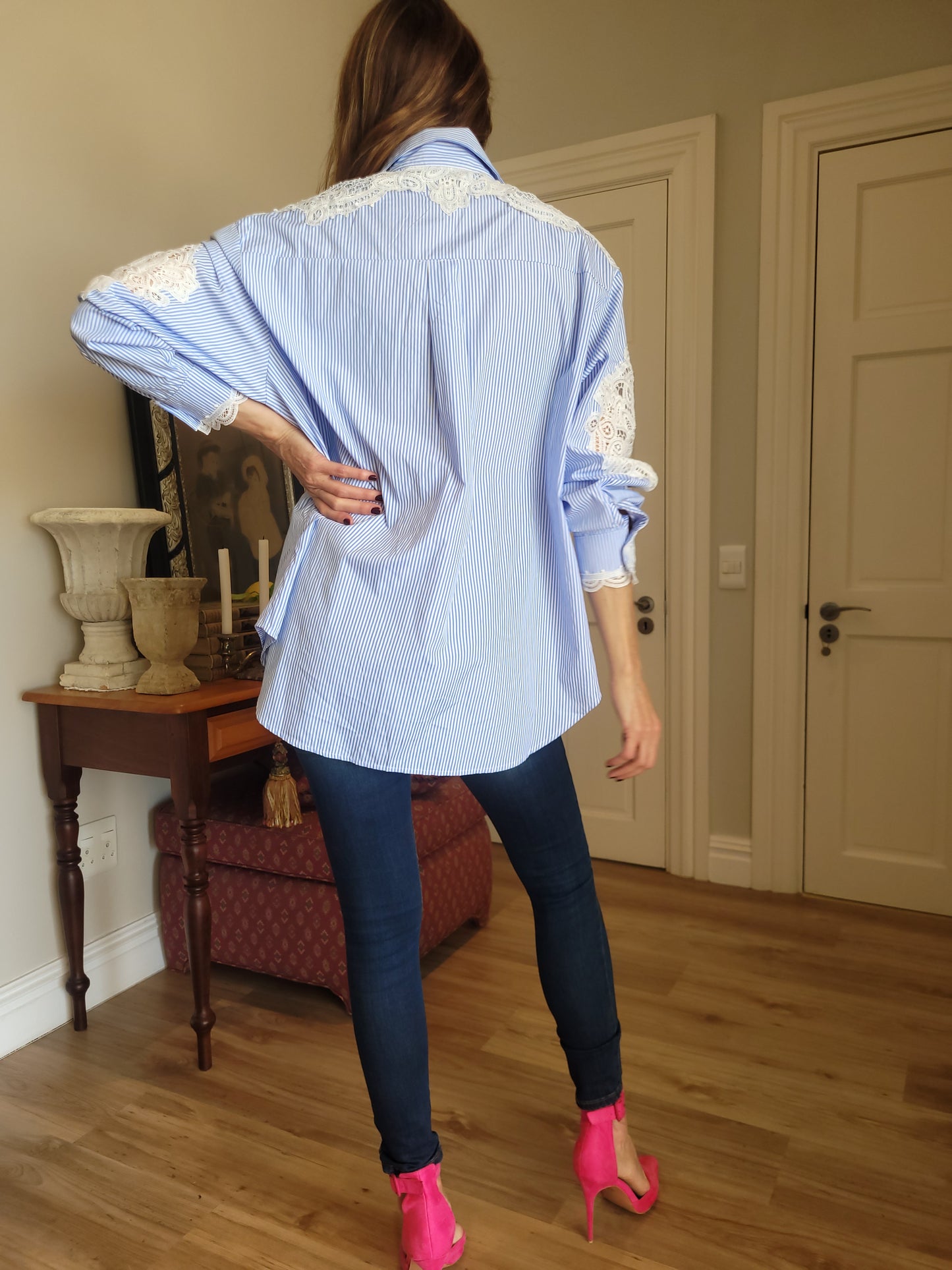 Oversize blue/white pinstripe shirt with lace detail.