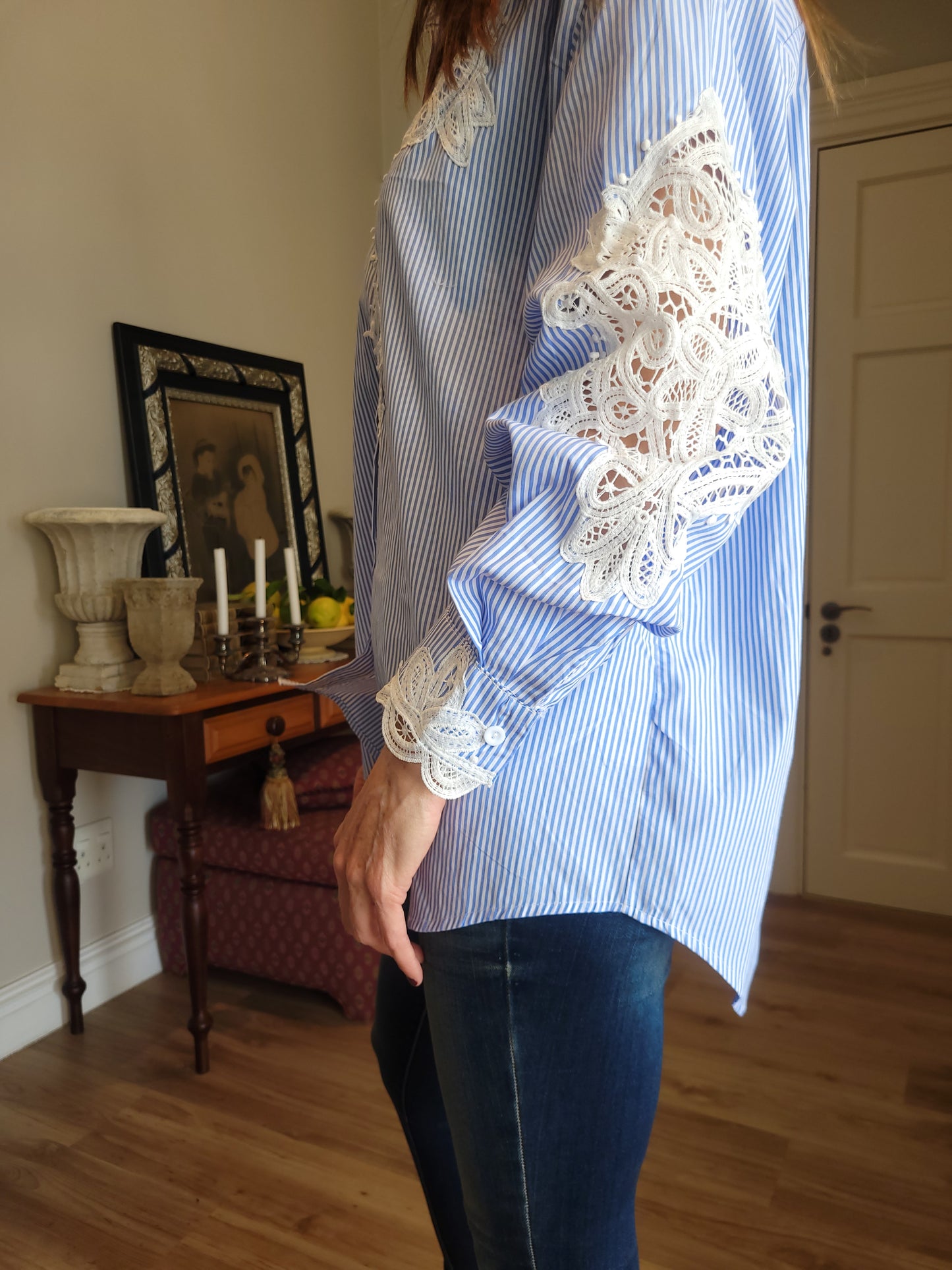Oversize blue/white pinstripe shirt with lace detail.
