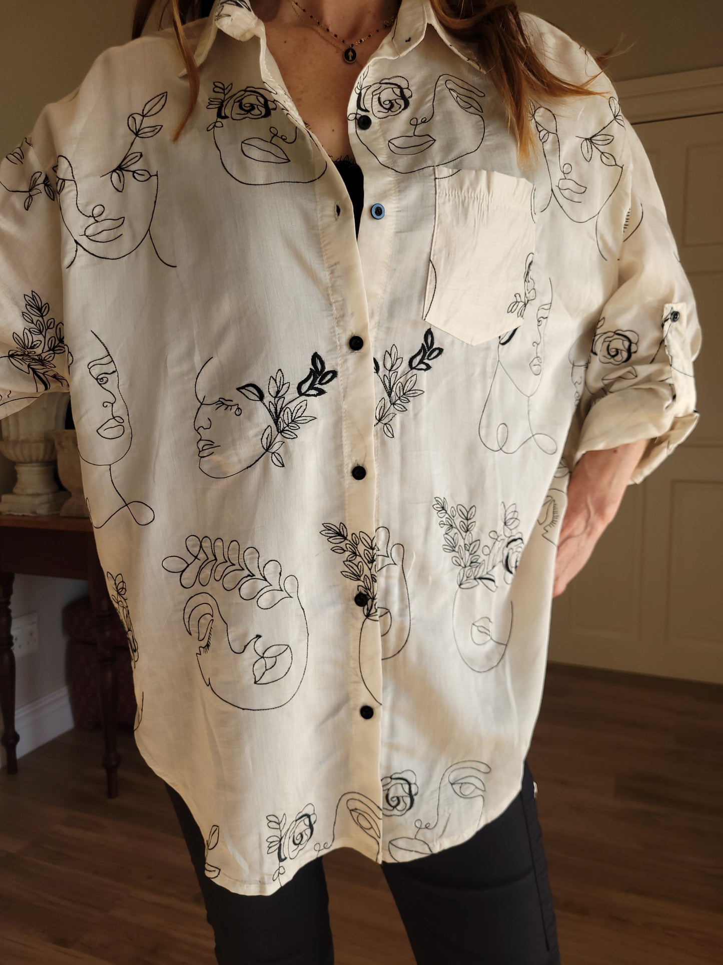 Oversize button down shirt with tab detail on sleeve.
