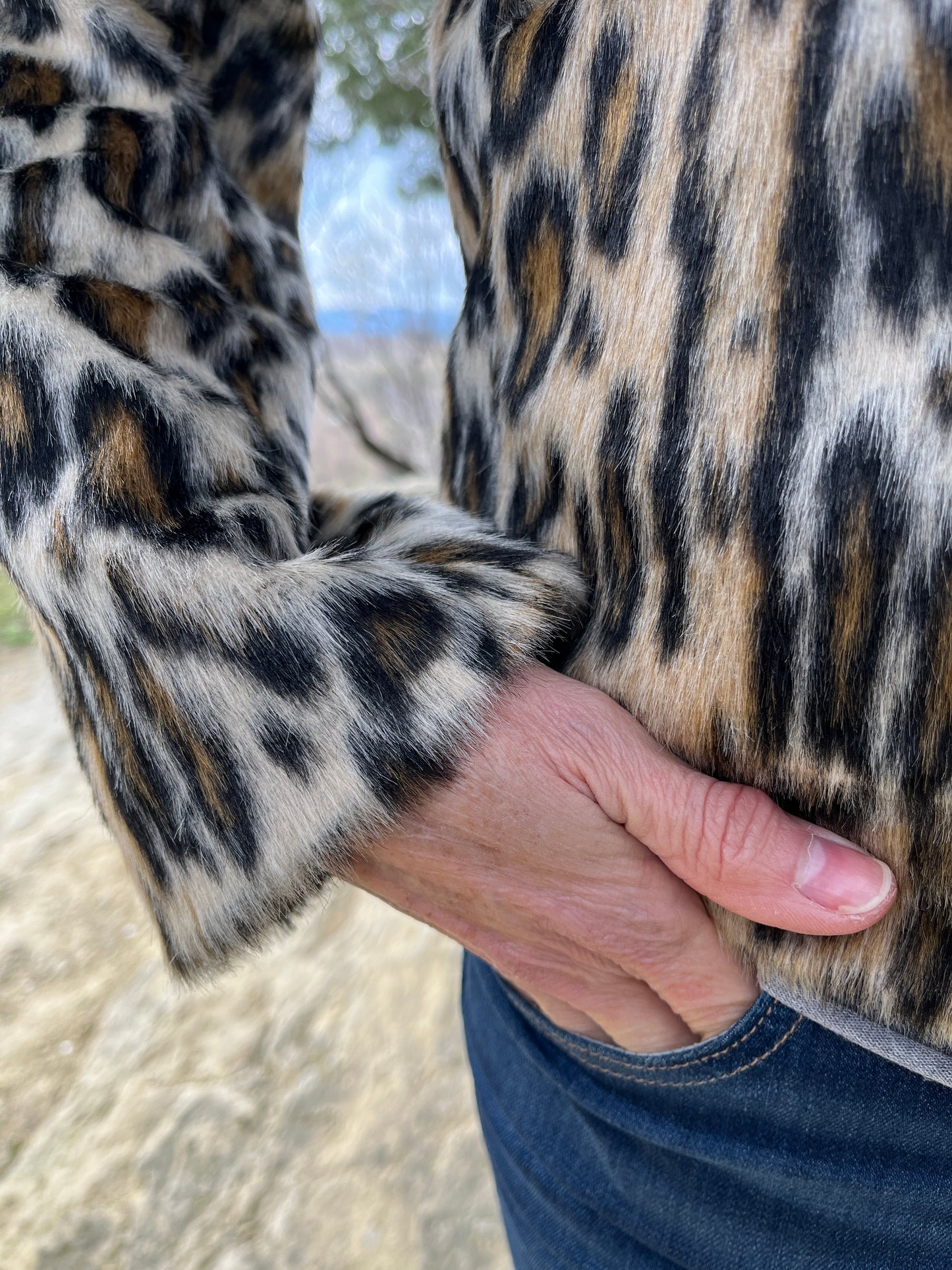 Faux fur (hair detail) fully lined button jacket.