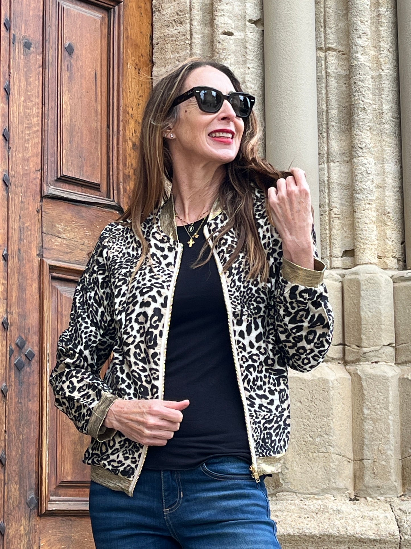 Fully lined leopard print bomber jacket with gold detail, side pockets and front zip.