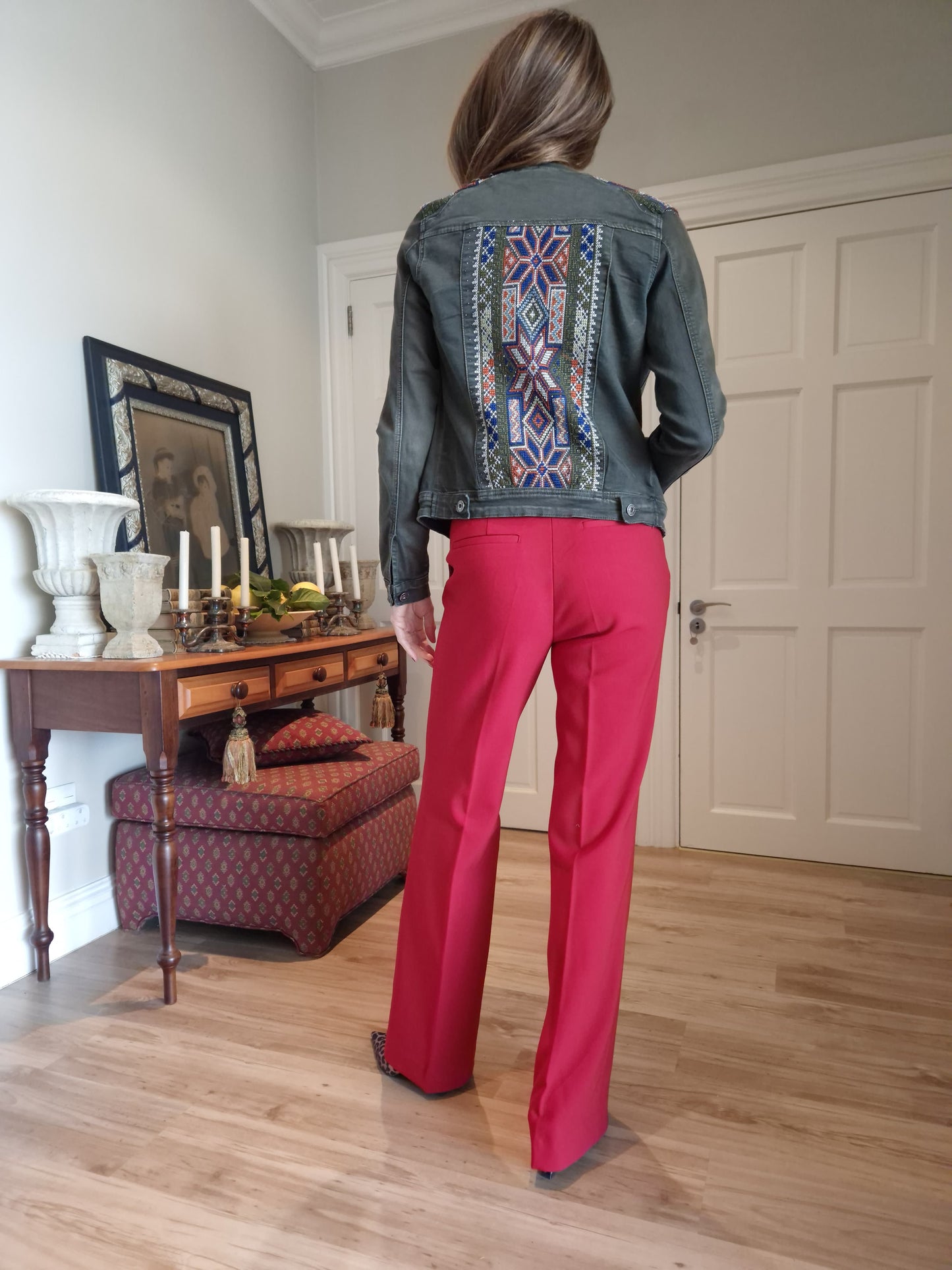 Denim jacket with embroidered detail on shoulder and back