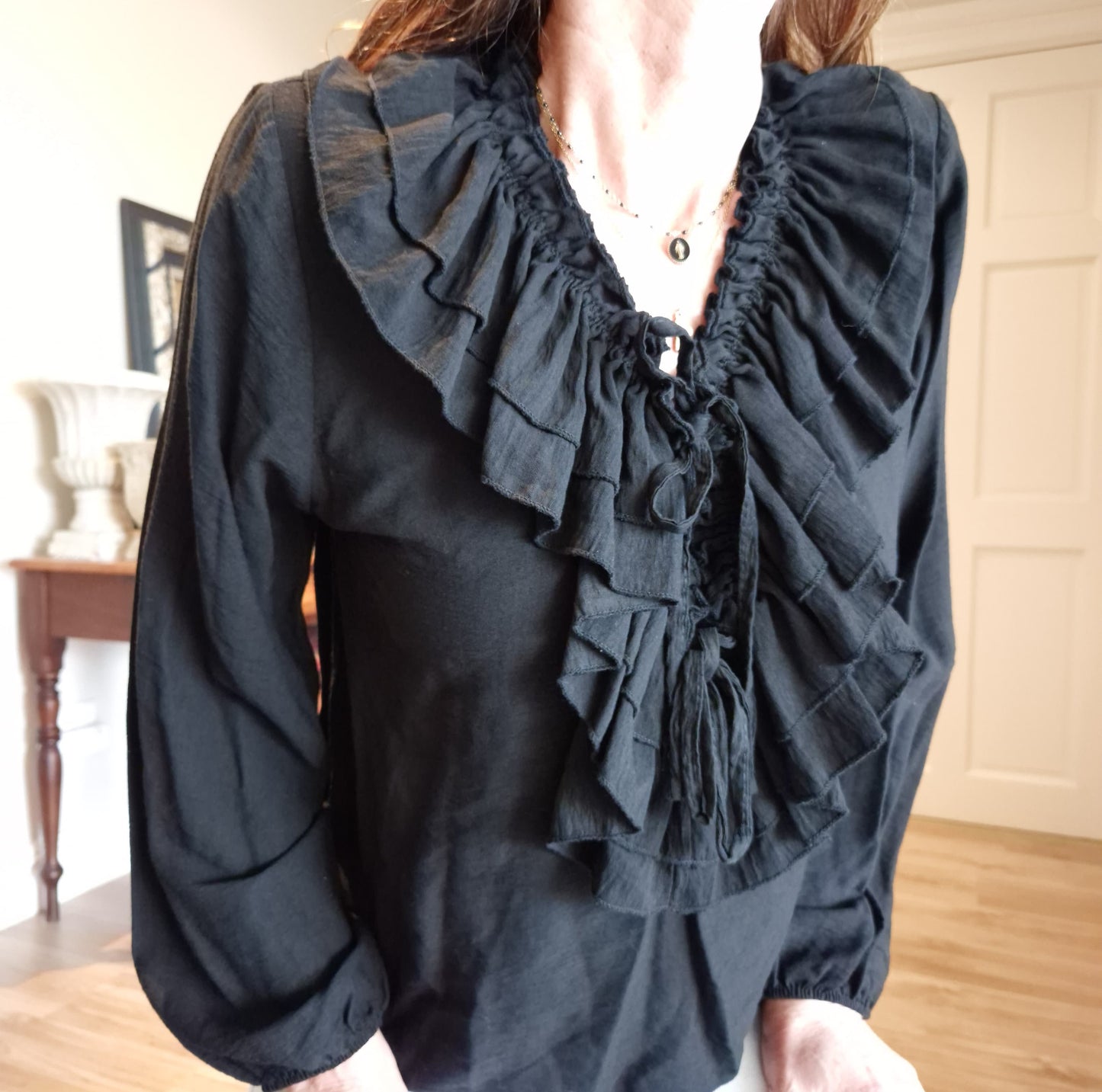 Blouse with elasticated cuff