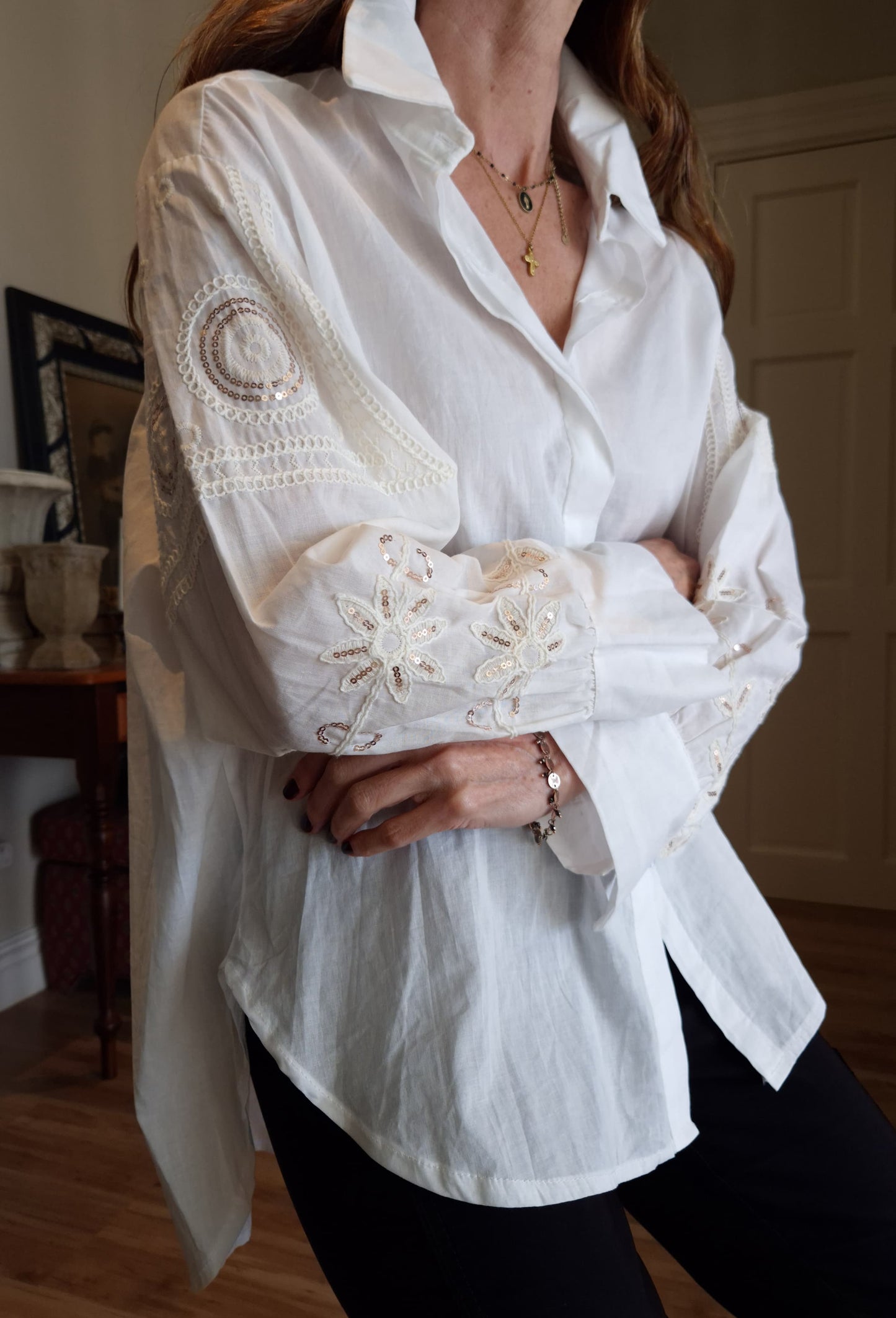 White button down oversized shirt with embroidery and sequins detail on the sleeve