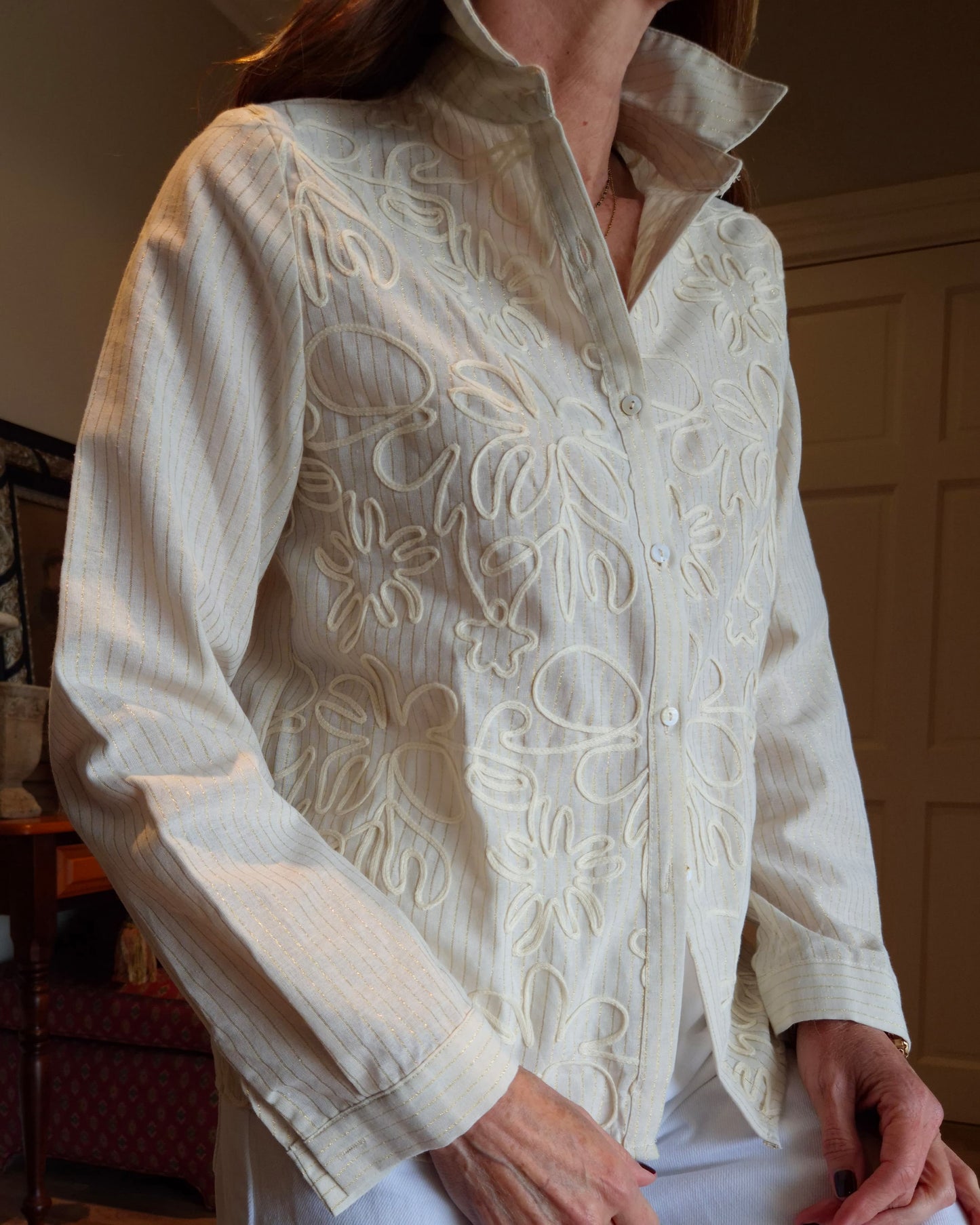 Long sleeve button down shirt with gold thread detail in the fabric.