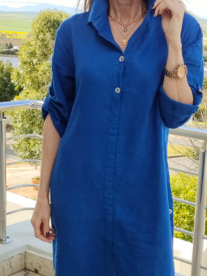 Long linen shirt dress with button detail on the side, tab in sleeve.