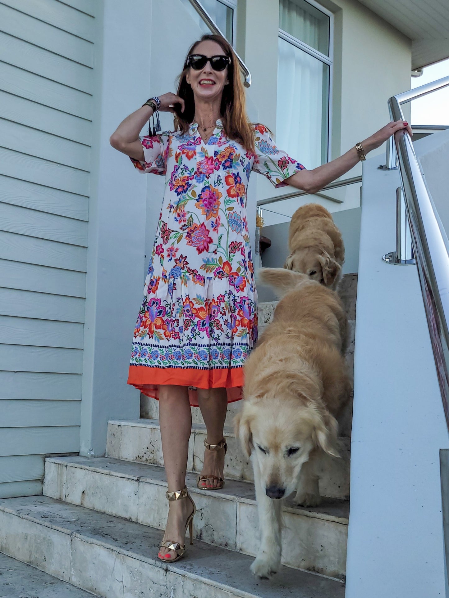 De Lis short sleeve dress with frill hem and pockets.