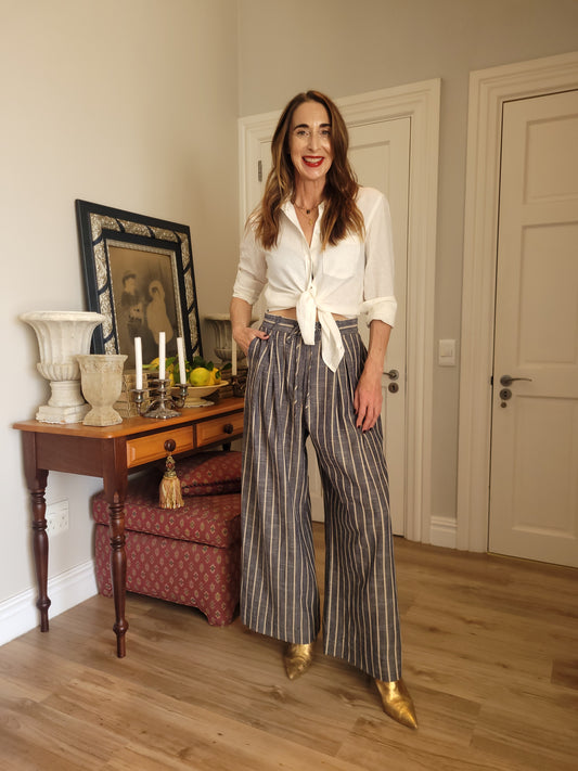Pinstripe pant with elasticated waist, drawstring and side pockets.