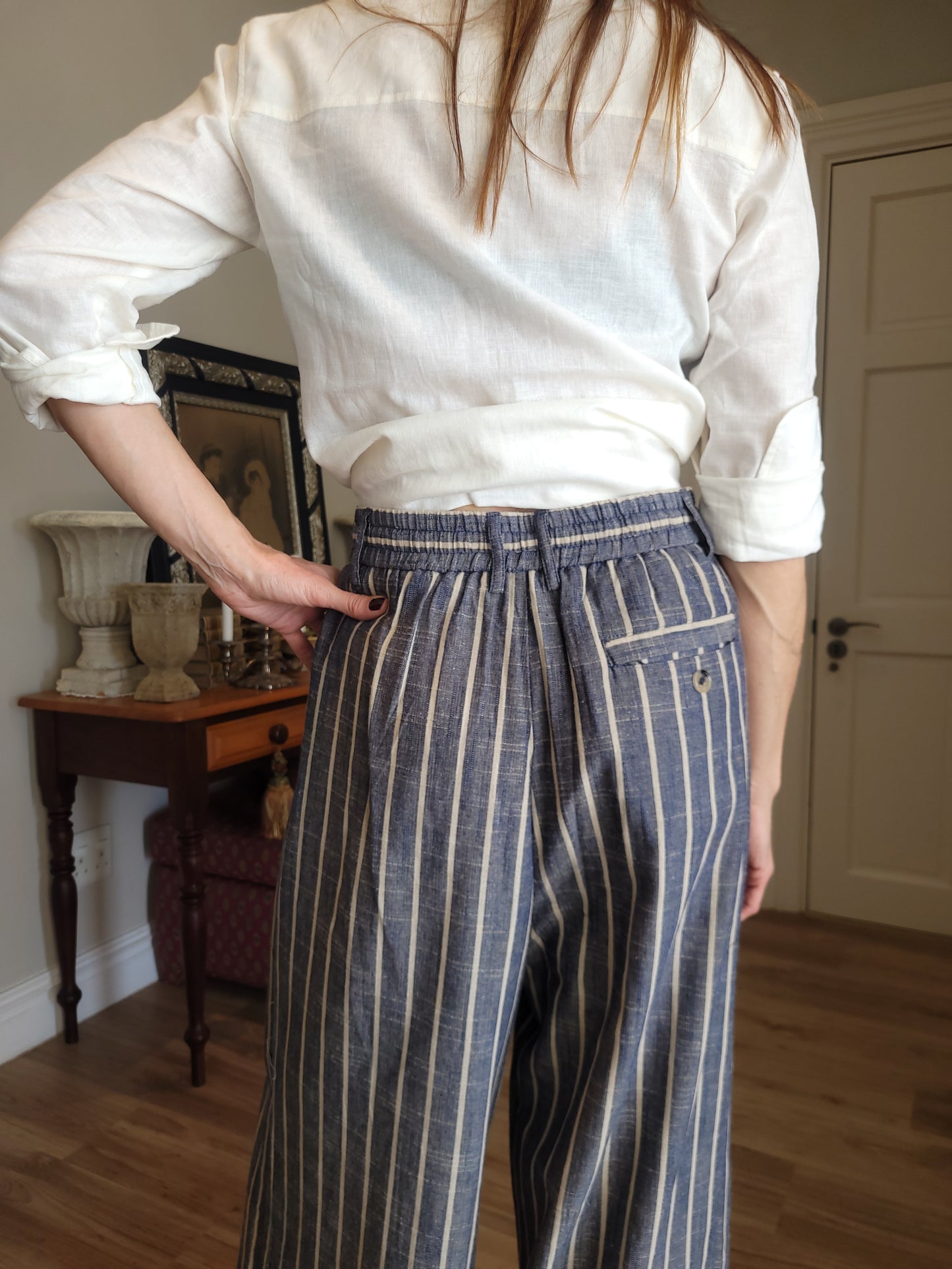 Pinstripe pant with elasticated waist, drawstring and side pockets.