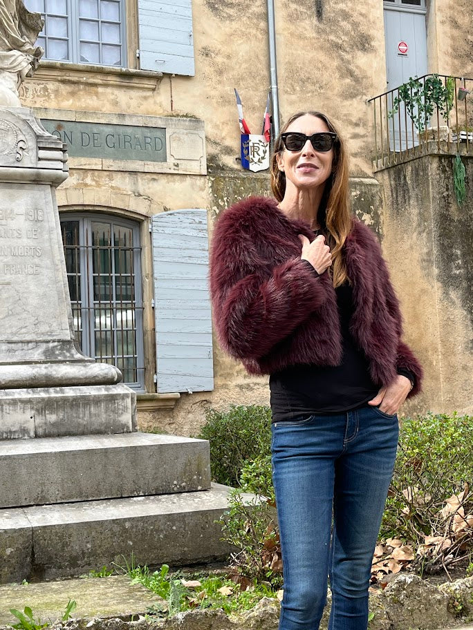 Fully lined Bordeaux faux fur with metal closures on the front and side pockets.