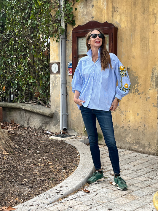Button down oversize blue/white striped shirt with embroidered sleeves.
