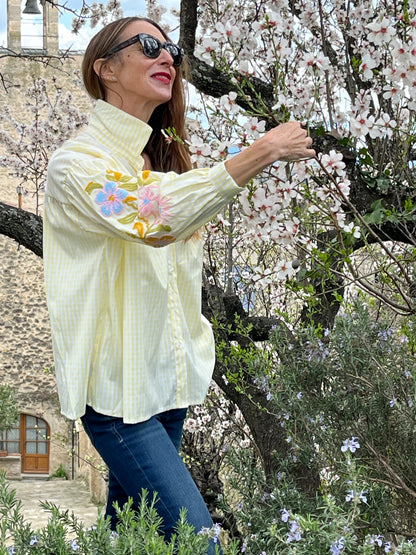 Button down oversize pale yellow/white gingham shirt with embroidered sleeves.