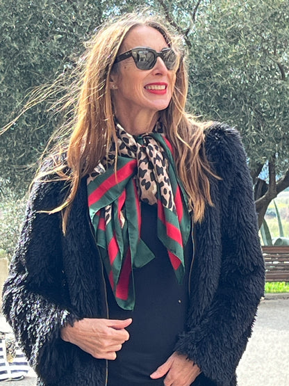 Fully lined black shaggy faux fur jacket with zip closure on the front.