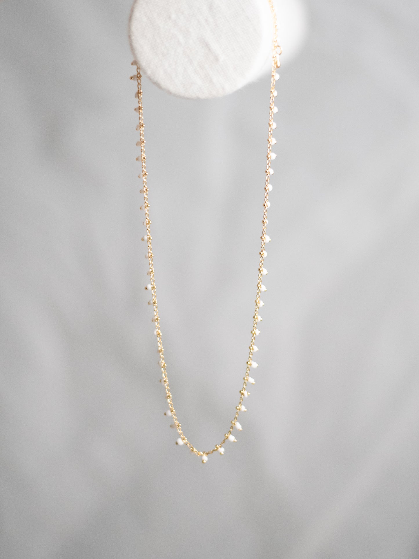 White bead necklace