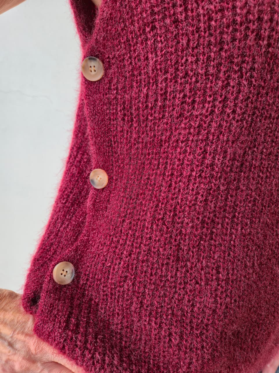 Supersoft poloneck with button detail on the sides.