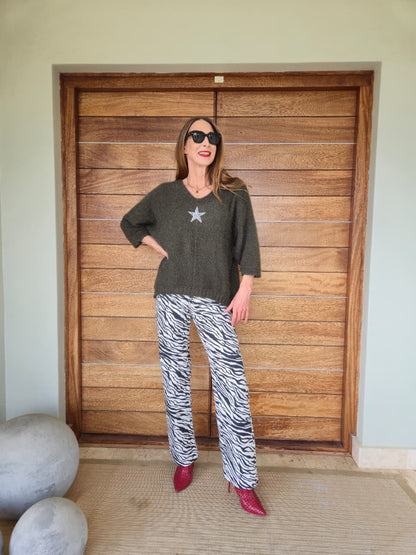 Olive green three quarter sleeve knit with bling stone detail.