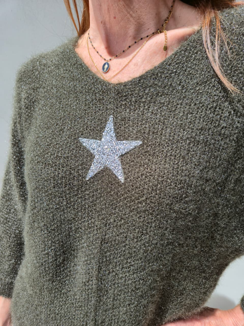 Olive green three quarter sleeve knit with bling stone detail.