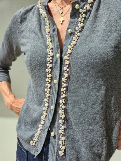 Three-quarter sleeve knit with pearl detail and buttons.