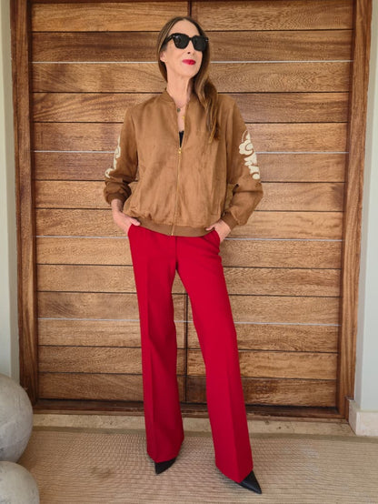 Suede feel bomber jacket with embroidered detail on the sleeves, elasticated cuff and side pockets.