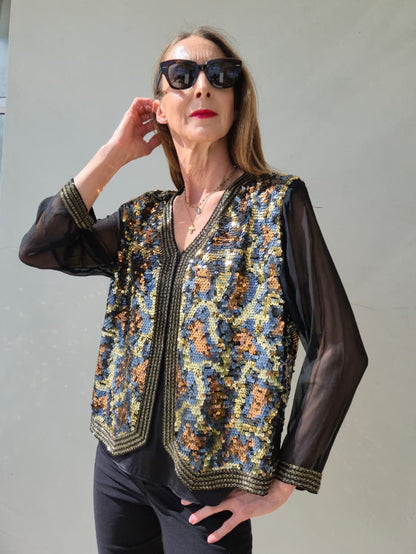 100% SILK and sequins fully lined jacket with chiffon sleeves and beaded detail.
