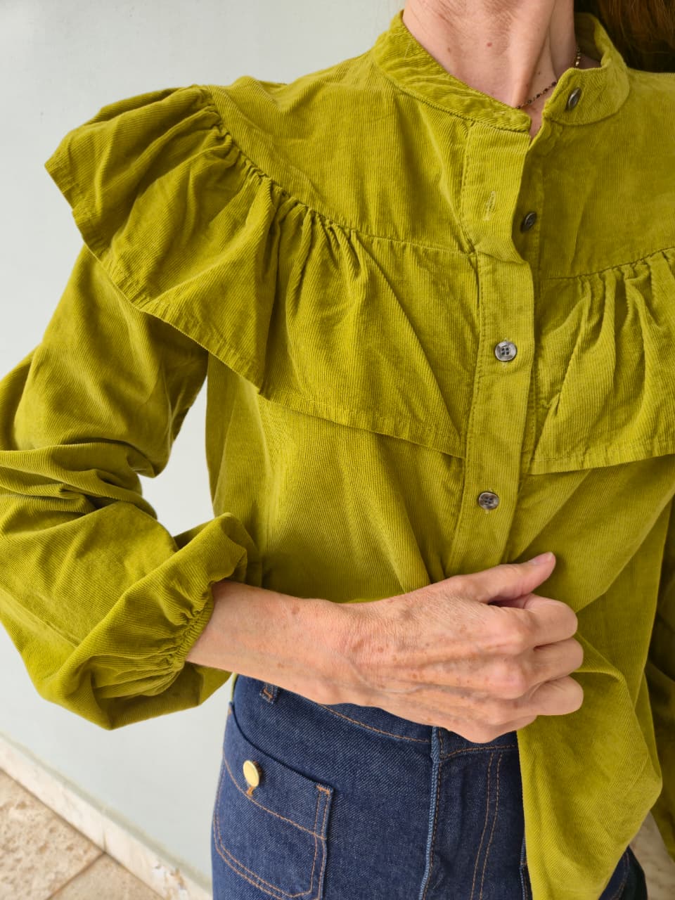 Fine corduroy chartreuse shirt with frill detail (front and back) and elasticated cuff.
