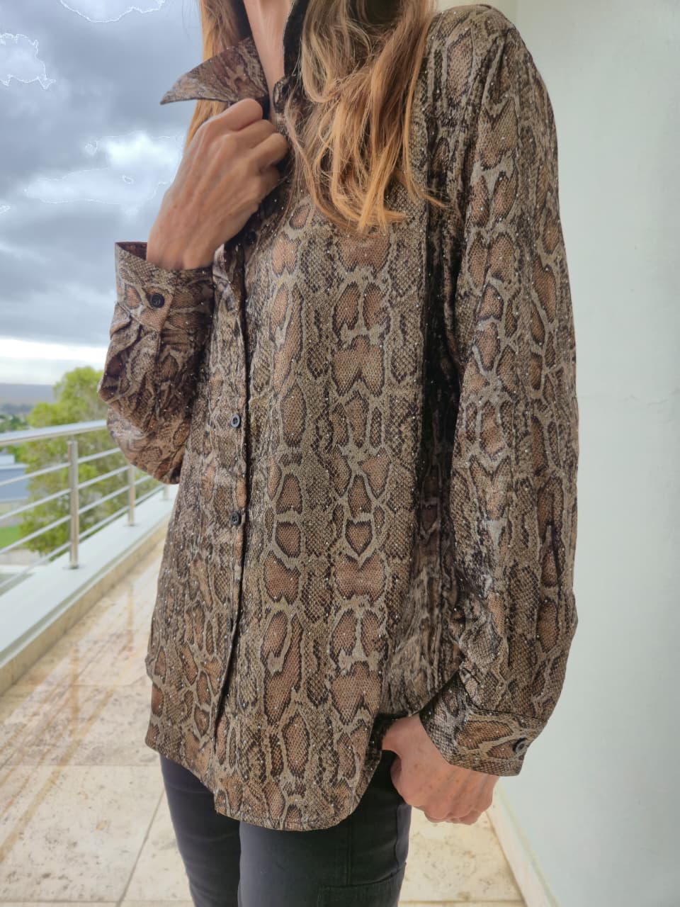 Snakeprint loose fit shirt with bling stone detail and cuffs.