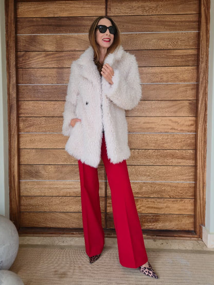 Faux fur jacket with side pockets.