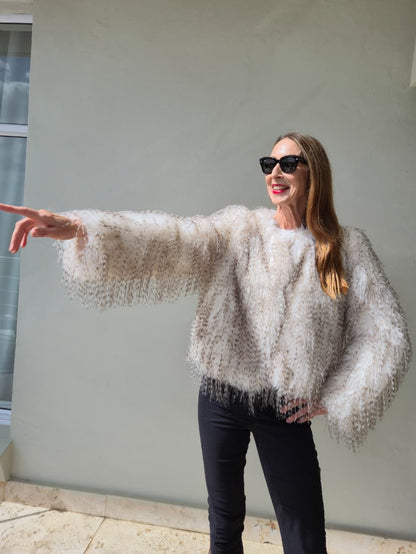 Fully lined faux fur jacket with side pockets.