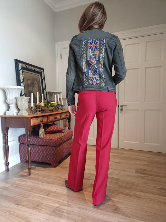 Denim jacket with embroidered detail on shoulder and back