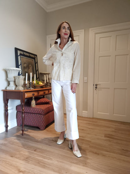 Long sleeve button down shirt with gold thread detail in the fabric.