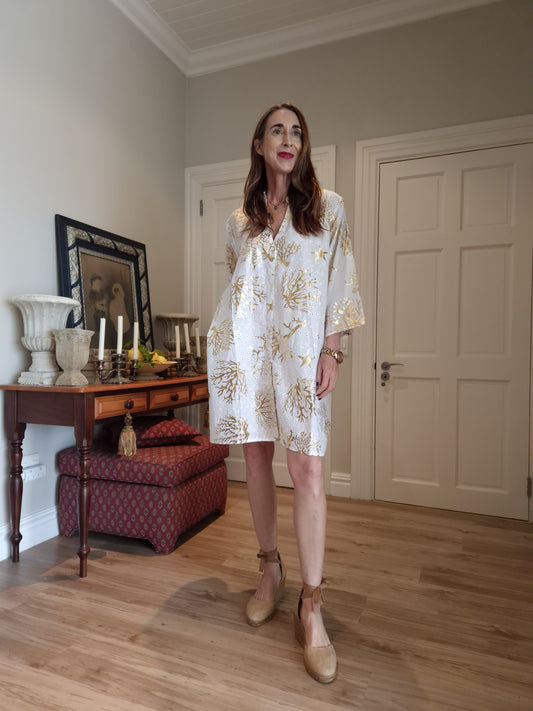 Anglaise beach dress with gold detail and side pockets