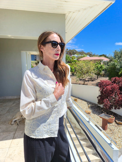 Long sleeve button down shirt with gold thread detail in the fabric.