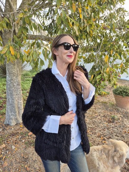 Shaggy black faux fur with pockets.