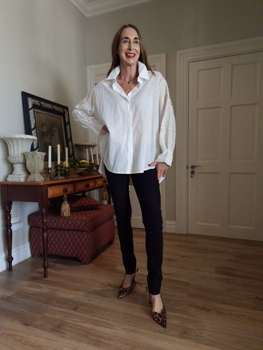 White button down oversized shirt with embroidery and sequins detail on the sleeve